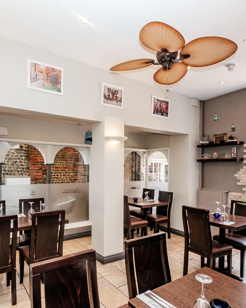 The dining room at Giuseppes with Italian arches and ceiling fans